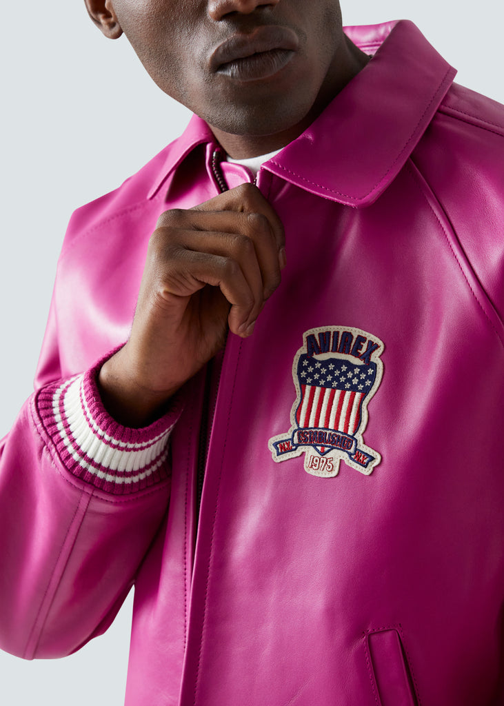 close up of the Avirex Icon leather bomber jacket logo. Pink