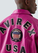Load image into Gallery viewer, Close up of the back of the Avirex leather Icon jacket in pink. embroidered logo
